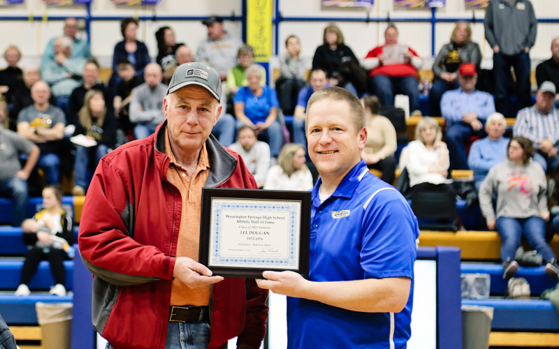 Hall of Fame inductee Lee Dougan, Class of 1976, is shown receiving his certificate. He is shown with WSHS Athletic Director Jason Kolousek.