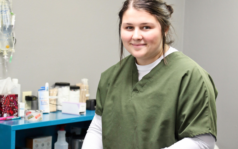 Heim brings sterilized tools to one of the surgery rooms.