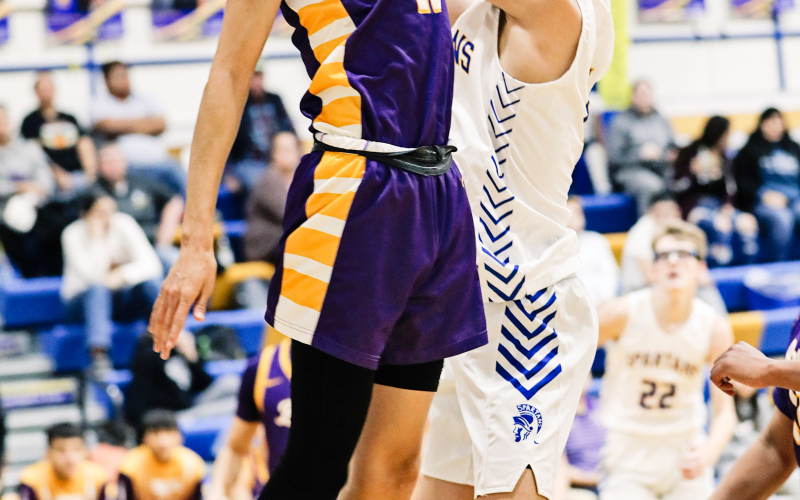 Ryder Michalek soars up to the net during home basketball action against Lower Brule.