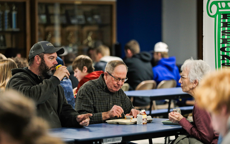 Dustin Weber, Delvin and Lois Feistner were among community members who enjoyed Homegrown Lunch Day last Tuesday.