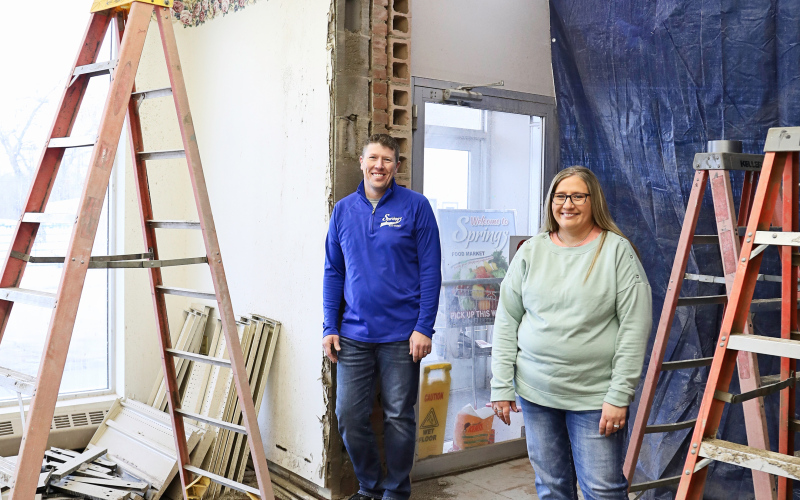 Springs Food Market and Jensen’s True Value owners Ryan Jensen and Lisa Younie stand in the newly-cut entry between the grocery store and future location of the hardware/variety store following a building swap with the Jerauld County Pioneer Museum.