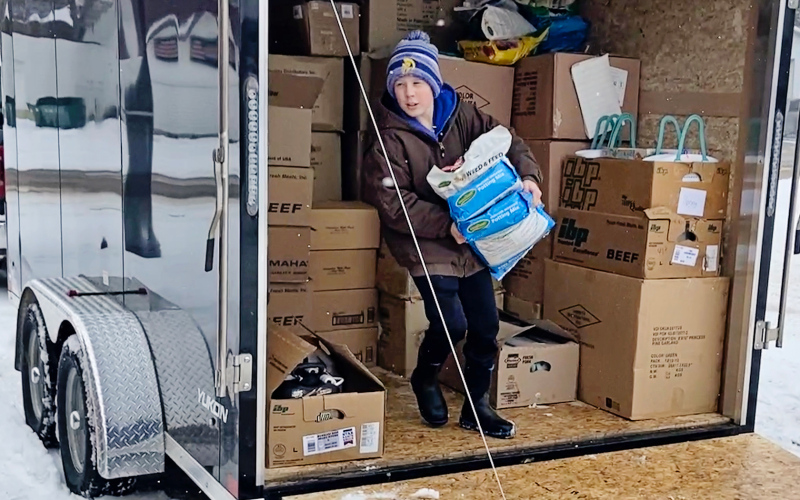 Sutten Jensen hard at work unloading goods and products from the hardware and variety store.