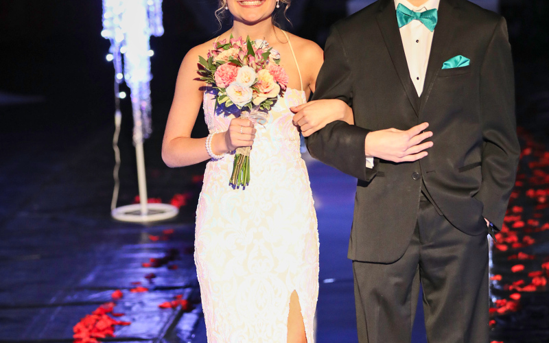 Ranick Fjerstad escorts Kennedy Kolousek.