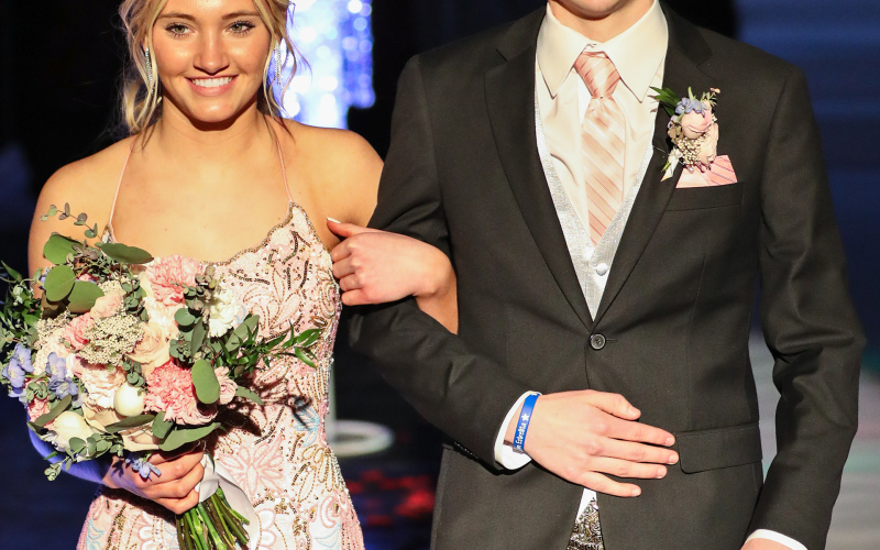 Austin Schimke escorts Taya Chemo.