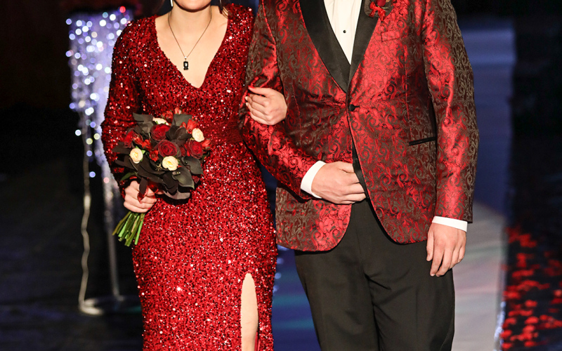 Carissa Scheel is escorted by Cayden Forest.