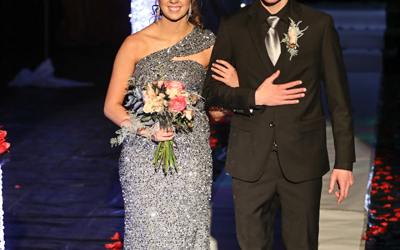 Hannah Heezen is escorted by Sawyer Donovan