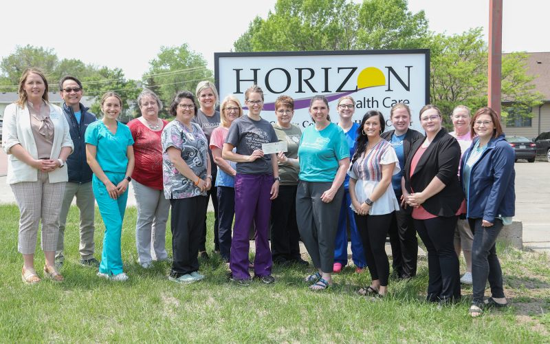 Horizon Healthcare employees accept a $5,000 matching donation from Wessington Springs Area Community Foundation members at the medical and dental clinic in Springs Tuesday.