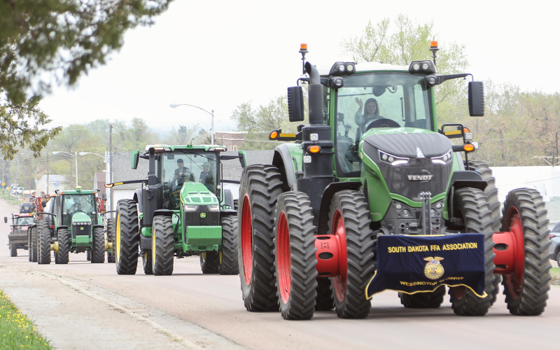 Alyssa Grohs led the charge through town driving a Fendt adorned with the Wessington Springs FFA Chapter banner.