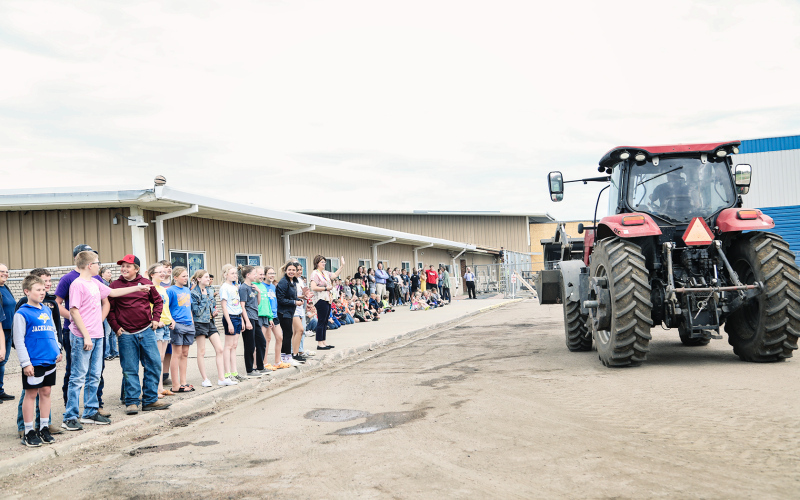 WSHS students capped off a successful “Drive a tractor to school day” on May 10 with a spin by the elementary school, much to the delight of the younger children.