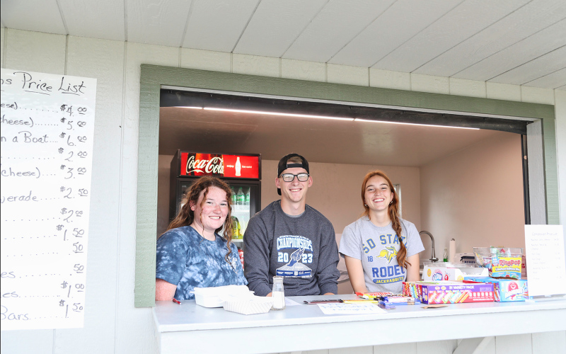 FCCLA members Riley Roduner, Jack Neely and Caroline Witte sell concessions at the ball field in Wessington Springs.