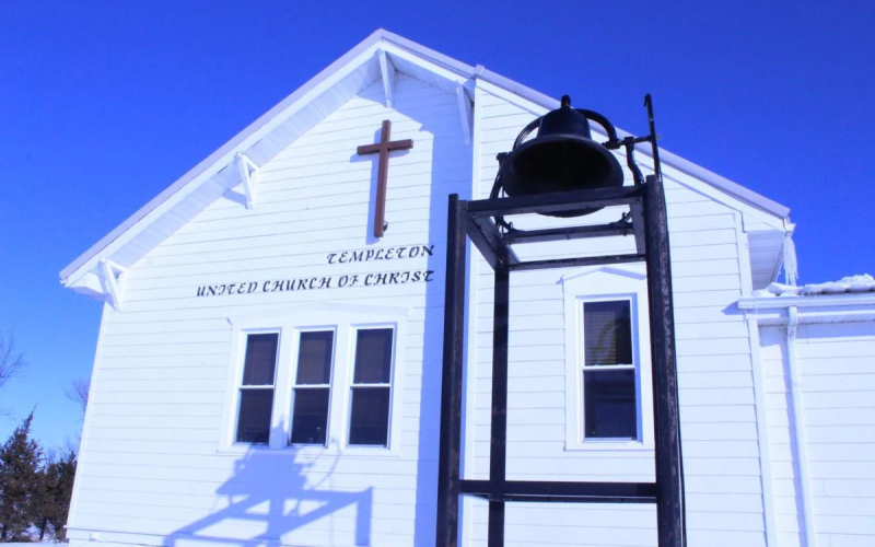 The original bell from the founder of Templeton United Church hangs in front of the current Templeton Church building and is rung regularly on Sundays.