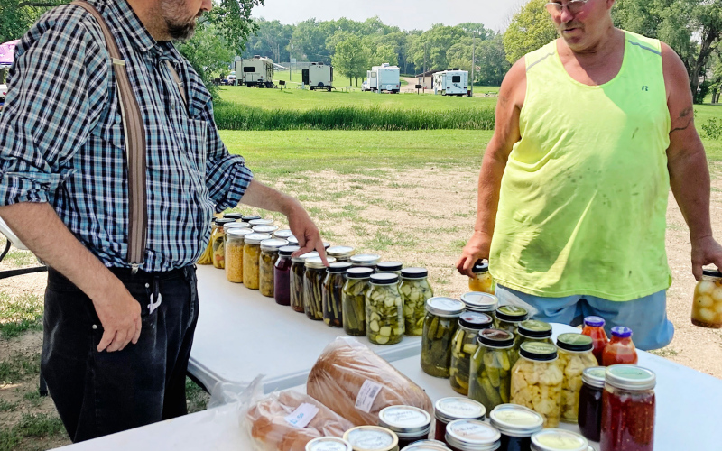 Leonard Von Eye grabs some garden goodies and visits with Marvin Stahl at a recent Spring Valley Colony Farmers Market. Find out what the master gardeners have planned to bring next to the local market in the city park.
