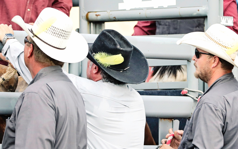 Members of the Foothills Rodeo Committee displayed a yellow feather in their hats as part of a suicide awareness and prevention campaign, built around the role of the rodeo pick up man. Wearing the feather signifies that they are available for encouragement, help or a hand up. Shown left to right are: Mark Getman, Marty Olson and Culley Tobin.
