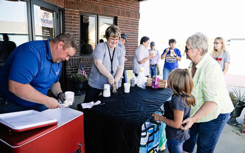 American Bank &amp; Trust employees Blake Willman and Susan Tebay served up root beer floats to kids and kids at heart alike. School administrators and staff set up plenty of photo opportunities throughout the elementary school.