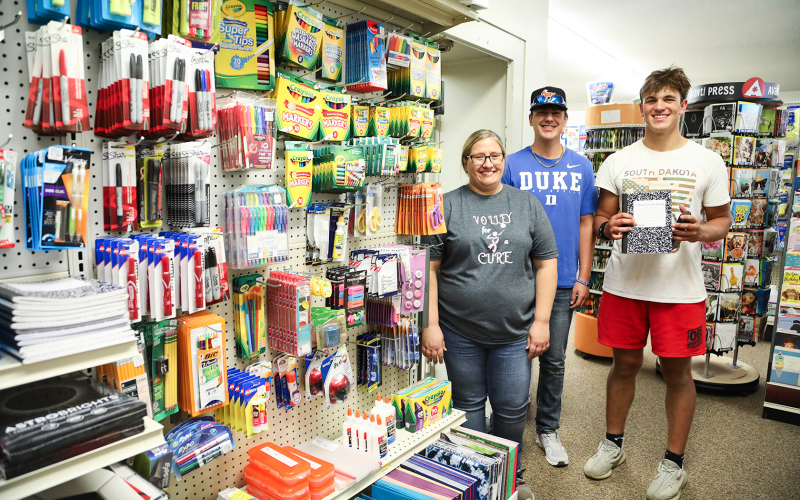 School supply shopping was a breeze at Jensen’s during Back to School Night. Owner Lisa Younie is shown with students Blake Miler and Holden Havlik.