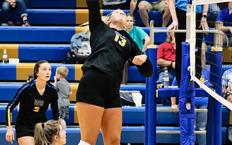 Avery Orth leaps skyward for one of 15 kills during the game.