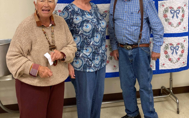 During the pie and ice cream fundraiser, Judy Winegar (pictured on left) held the drawing for the handmade quilt donated by Sharon DiCarlo (middle), and was won by Chris Christensen (right).
