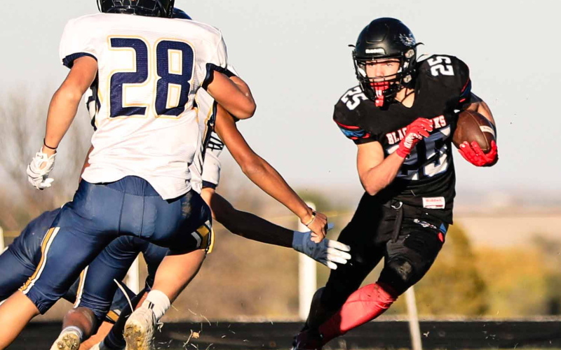 Hayes Havlik carries the ball during the first round playoff game in Wessington Springs.