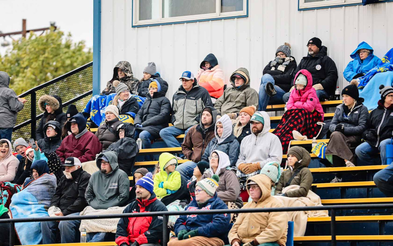 A cold yet dedicated crowd donned blankets and stocking caps for a chilly damp evening of football.