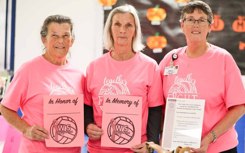Jean Ferguson and Delia Atkinson sold "In Memory" and "In Honor" cards. They are shown with Ellen Powell of Weskota Foundation.