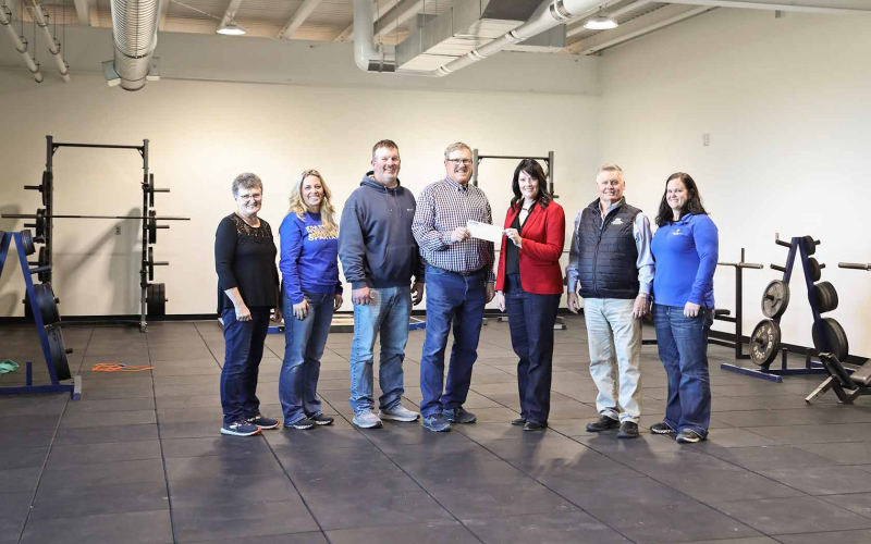 Shown during Monday’s check presentation are, left to right: Build Springs board members Joyce Krueger, Hilary Grohs, Scott Kolousek, Roger Hainy, Venture Communications Cooperative Marketing Supervisor Mary Knox, Venture Communications Cooperative board member Brian Bergeleen and Build Springs board member Erin Yost.