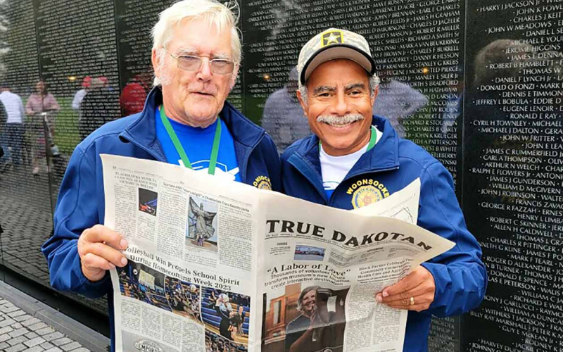 Dave Kogel and his guardian Pastor Agapito Aviles Jr. with an edition of the True Dakotan at the Vietnam Memorial.