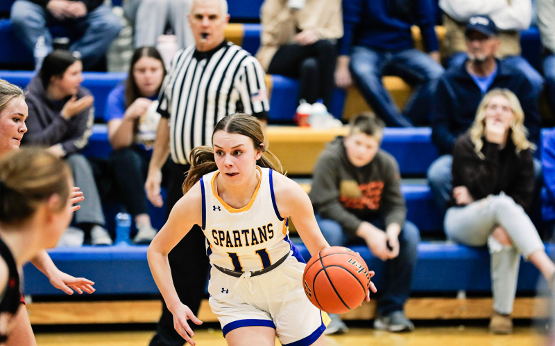 Ashlyn Weber evades a defender, making her way up the court.