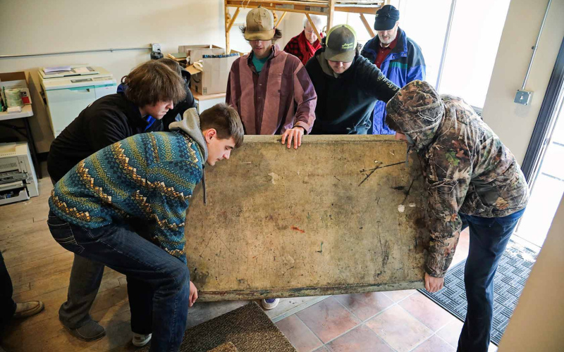 Wessington Springs High School FFA Chapter members lent their braun to carry out and load up the weighty marble top.