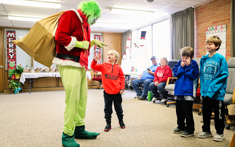 Coleman brothers Kactus, Kix and Kaddilac enjoy a laugh while The Grinch attempts to pull a Christmas prank.