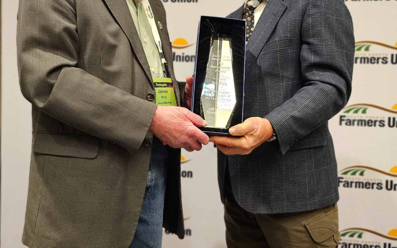 South Dakota Farmers Union names Jerauld County farmer and life-long public servant Jim Burg the 2023 Ag Ambassador in recognition of his leadership and dedication to South Dakota agriculture and rural communities. SDFU President Doug Sombke presented the award during an award ceremony held during the organization's state convention.