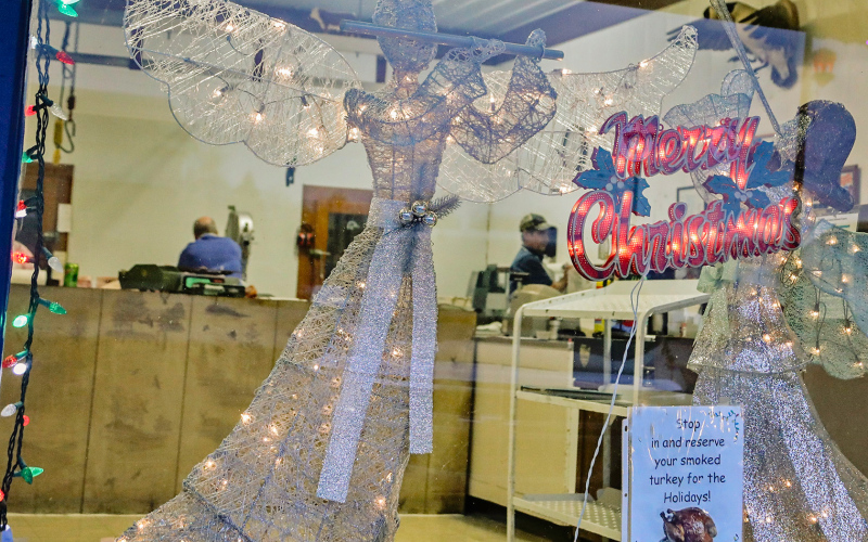 Dennis Mettler, Tom Mebius and Sue Campos were busy working at Mettler’s Locker on Main Street in Wessington Springs Tuesday morning behind a festive storefront decorated for the holidays. Mettler’s is among the many area businesses that took time to craft a Christmas greeting for their customers in this special print and e-edition of the True Dakotan.