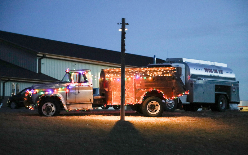 A vintage truck at Total Oil / Construction takes on new life with several strands of cheery Christmas lights.