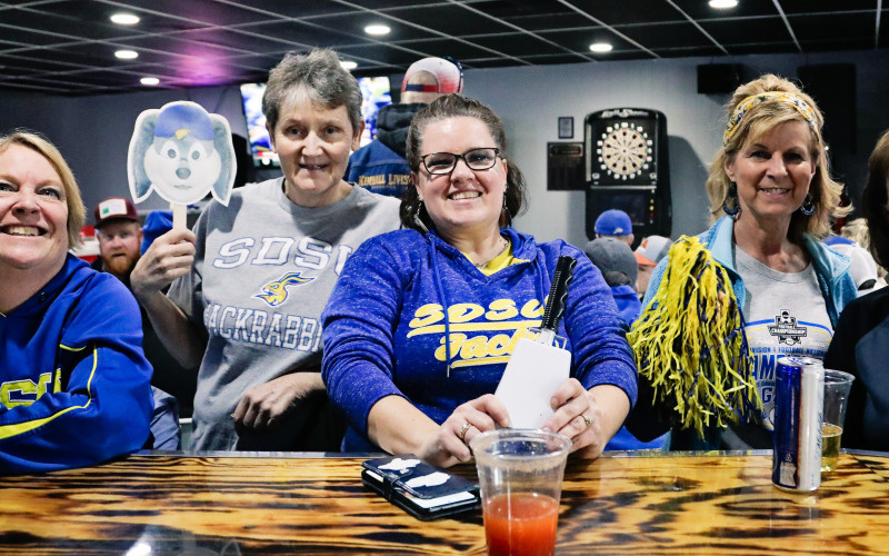 Decked out in their fan gear, left to right are: Linda Willman, Gloria Vavra, Laura Baker, Kim Burg and Becky Thompson.