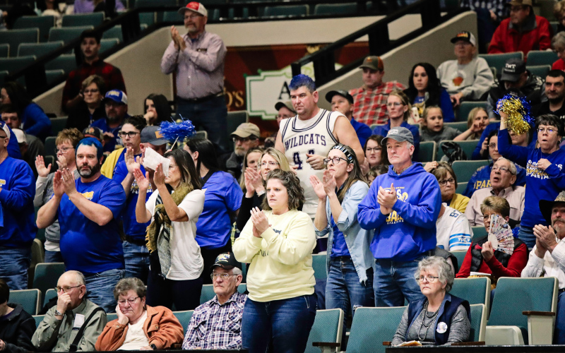 Laser focused on the game, a devoted crew of fans decked out in blue and gold cheer on the Lady Spartans.