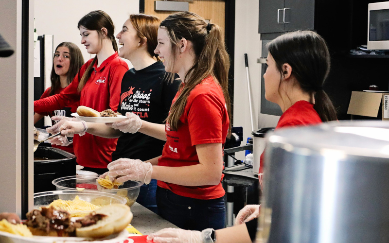 Members of the Wessington Springs Chapter of FCCLA served the free pork sandwich meal sponsored by Venture Communications, Total Oil / Total Construction, H&amp;H Ag Solutions, Coca-Cola and Springside Sales, Inc.