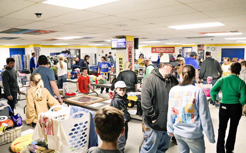 Hundreds of people filtered through the Wessington Springs Elementary cafeteria for a fundraising event for the Carothers family. Their 12-year-old daughter, Reba, died Monday, days after she was struck by a car while trying to board a school bus on Jan. 26. The fundraiser, which involved a dinner, a silent auction and a 50-50 raffle, began before the Wessington Springs, Wolsey-Wessington varsity basketball game that took place in the adjacent gym. PHOTO BY KRISTI HINE / TRUE DAKOTAN