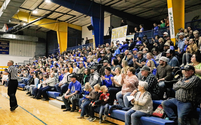Hundreds of people filtered through the Wessington Springs Elementary cafeteria for a fundraising event for the Carothers family. Their 12-year-old daughter, Reba, died Monday, days after she was struck by a car while trying to board a school bus on Jan. 26. The fundraiser, which involved a dinner, a silent auction and a 50-50 raffle, began before the Wessington Springs, Wolsey-Wessington varsity basketball game that took place in the adjacent gym. PHOTO BY KRISTI HINE / TRUE DAKOTAN