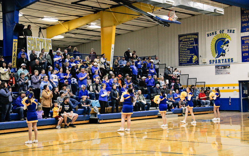 Spartans cheerleaders and a large crowd cheer for the Lady Spartans.