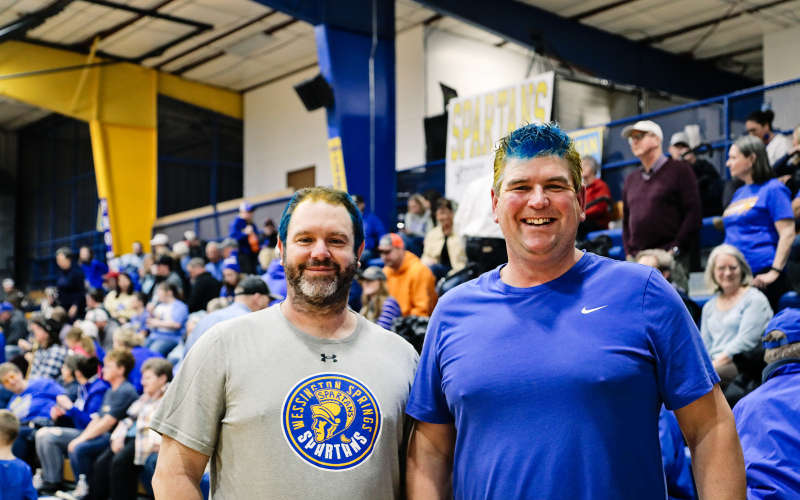 Super fans Dustin Weber and Gerry Orth show their spirit with blue and gold hair.