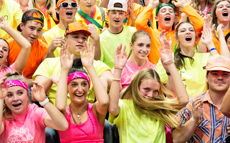 Cheers from the student section were even louder than their neon spirit dress Friday. PHOTO BY RILEY RODUNER