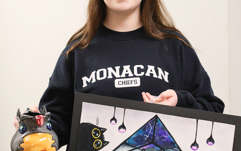 Darcy Ormsmith with her Watercolor titled “Cat Tea Party,” 2nd place and Ceramic sculpture “Forest Brew,” 1st place.