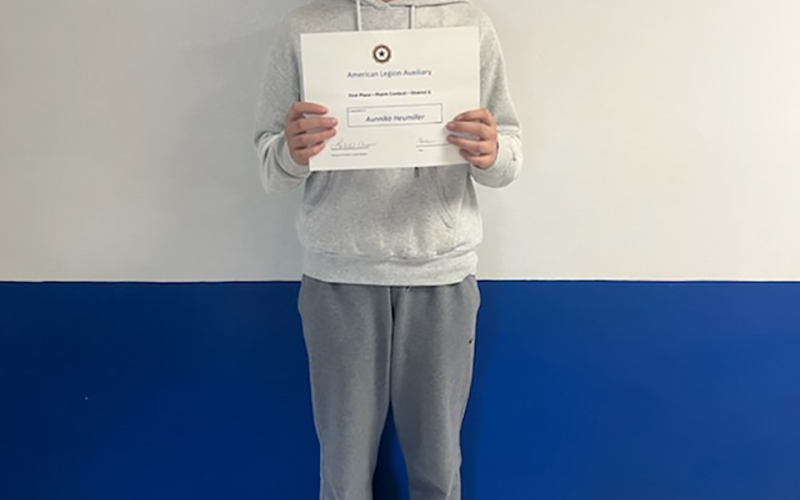 Aunnika Heumiller’s poem was selected at the district level to advance to the state level. She is shown holding her first place District 6 certificate. PHOTO COURTESY WSES