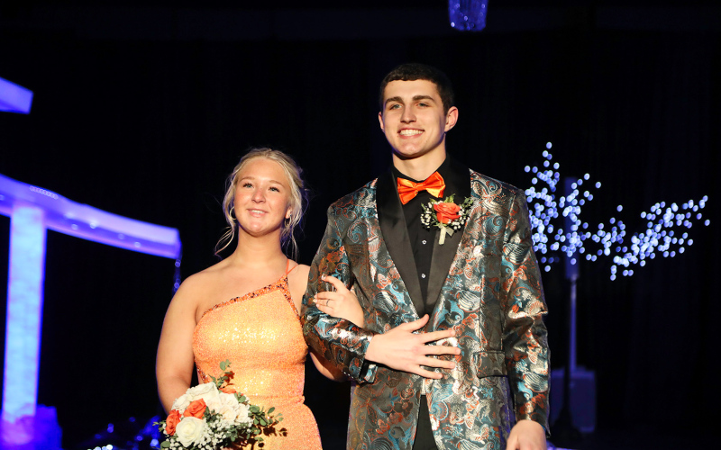 Dakotah Larson is escorted by Brock Krueger.