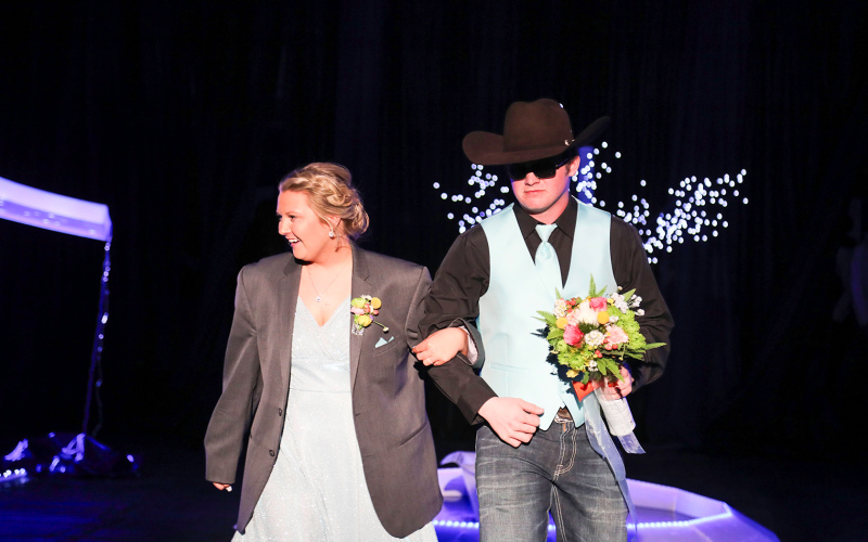 Tristan Jensen is escorted by Garett Anson.