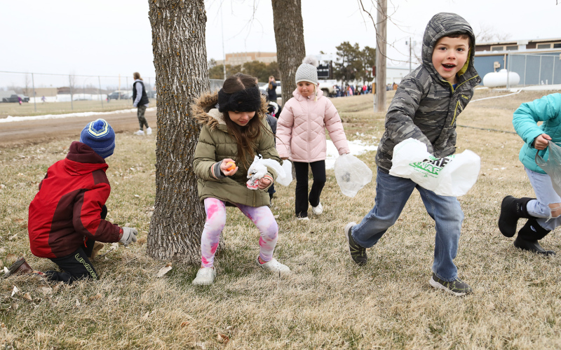 Despite the chill, visiting and local kids and their families enjoyed time outdoors together as they canvassed the city parks on the lookout for brightly colored, sought-after, candy and prize- filled eggs.