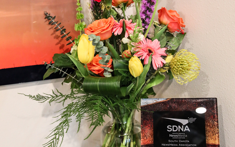 South Dakota NewsMedia Association (SDNA) plaque, honorary gavel and flowers presented to Kristi Hine by SDNA board and staff for work done during the 2023-24 year as SDNA President.