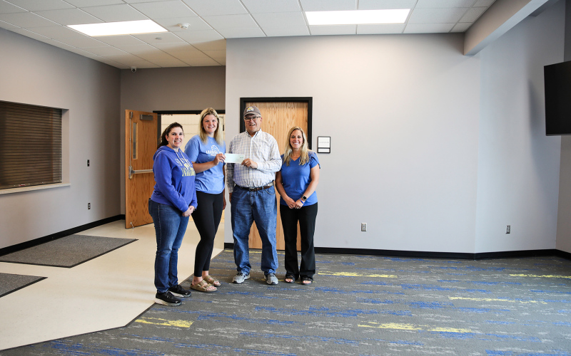 KRISTI HINE / TRUE DAKOTAN Avery Orth presented proceeds from the Farm, Home and Health Show to board members of Build Springs on Monday. Shown left to right are Julie Bruckner, Avery Orth, Roger Hainy and Hilary Grohs.