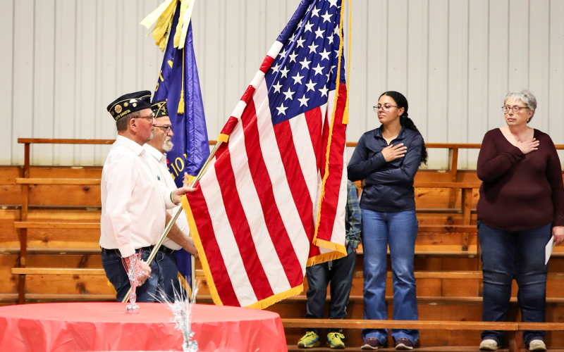 Gary Orth (foreground) and Dick Small retire the colors during the Alpena Memorial Day program held at the Owen Kunze American Legion Post 116.