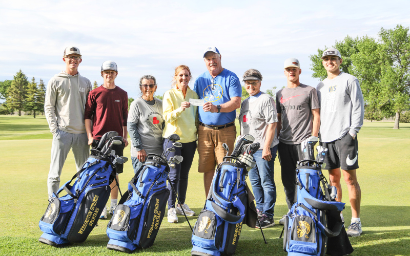 Proceeds from the Pair of Jacks Memorial Tournament were presented to WSHS golf coaches last Friday. Shown left to right are: Luke Larson, JD Thompson, Jean Ferguson, Head Coach Regina Teveldal, Assistant/Junior High Coach Pat Law, Joyce Krueger, Blake Larson and Brock Krueger.
