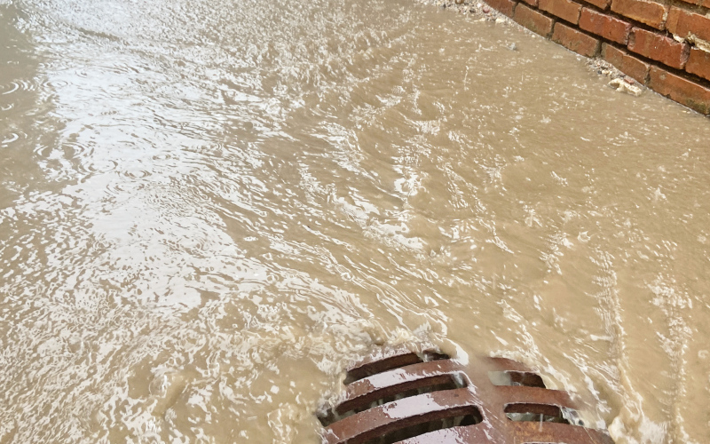 Water rushes down a Wessington Springs Main Street alley Thursday afternoon. Jerauld County is among the South Dakota count its under a flood watch through Saturday morning.